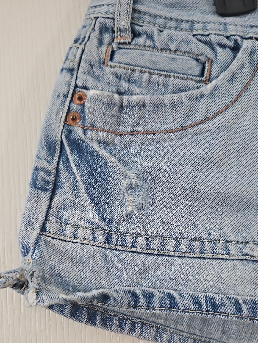 American Eagle | Y2K light denim shorts distressed flap-closure back pockets. 12 - Picture 2 of 13